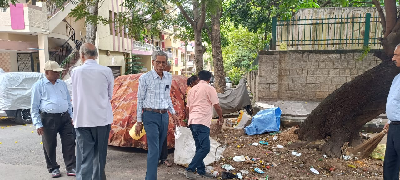 Members participating in a neighbourhood cleanliness drive